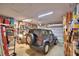 Spacious garage with shelving, storage, and a Jeep Wrangler, blending utility and hobby space at 2577 Canyon Crest Dr, Lakeland, FL 33811
