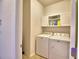 Laundry room equipped with a washer, dryer, and storage cabinets for a functional laundry space at 2577 Canyon Crest Dr, Lakeland, FL 33811