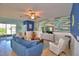 Comfortable living room with coastal decor, a TV, and sliding glass doors at 2577 Canyon Crest Dr, Lakeland, FL 33811