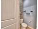 Powder room featuring a stylish wall design and modern fixtures at 2577 Canyon Crest Dr, Lakeland, FL 33811