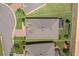 Aerial view of the home's roof, landscaping, and surrounding property with marked lot lines at 2733 Attwater Loop, Winter Haven, FL 33884