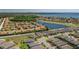 Aerial view of home in community with lake and surrounding neighborhood at 2733 Attwater Loop, Winter Haven, FL 33884