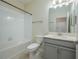 Bathroom featuring a shower with a tub combination, a toilet, and a vanity with a modern sink at 2733 Attwater Loop, Winter Haven, FL 33884