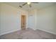 Bedroom with neutral walls, plush carpeting, closet space, and an attached bathroom providing easy access at 2733 Attwater Loop, Winter Haven, FL 33884
