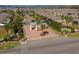 Aerial view of gated community entrance with lush landscaping and brick-paved entry at 2733 Attwater Loop, Winter Haven, FL 33884