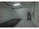 Spacious garage with epoxy flooring, water heater and garage door with chain drive at 2733 Attwater Loop, Winter Haven, FL 33884