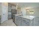 Well-lit kitchen with stainless steel appliances and a center island that overlooks the dining area at 2733 Attwater Loop, Winter Haven, FL 33884