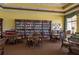 Community library with cozy seating arrangements, bookshelves, and natural light at 2733 Attwater Loop, Winter Haven, FL 33884