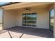 Covered patio with brick flooring and ceiling fan provides a relaxing outdoor space at 2733 Attwater Loop, Winter Haven, FL 33884