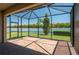 Screened-in patio with brick flooring offers outdoor living space and views of the backyard at 2733 Attwater Loop, Winter Haven, FL 33884