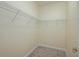 Walk-in closet with carpeted floor and a white coated wire shelving system for plenty of storage space at 2733 Attwater Loop, Winter Haven, FL 33884