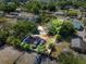 Aerial view of a large, partially wooded lot showing the shed, backyard, and surrounding area at 275 Cherry Laurel Ln, Winter Haven, FL 33880