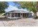 Home with a large screened in patio at 275 Cherry Laurel Ln, Winter Haven, FL 33880