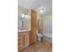 Bathroom features a vanity with sink, neutral color walls, and a shower with a shower curtain at 275 Cherry Laurel Ln, Winter Haven, FL 33880