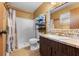 Bathroom featuring a tiled shower, toilet, and decorative mirror at 275 Cherry Laurel Ln, Winter Haven, FL 33880