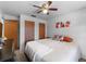 A cozy bedroom with neutral colors, ceiling fan, and practical closet space at 275 Cherry Laurel Ln, Winter Haven, FL 33880