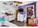 bedroom with hardwood floors, two dressers, a television, and an open closet at 275 Cherry Laurel Ln, Winter Haven, FL 33880