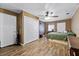 Spacious bedroom with wood-look flooring, two closets, and a ceiling fan at 275 Cherry Laurel Ln, Winter Haven, FL 33880