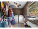 Functional laundry room with washer, dryer, closet storage and natural light from a window at 275 Cherry Laurel Ln, Winter Haven, FL 33880