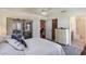 Spacious bedroom with direct access to a screened-in patio, bathroom, and walk-in closet, creating a comfortable suite at 284 Lake Suzanne Dr, Lake Wales, FL 33859