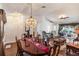 Bright dining area featuring hardwood floors that seamlessly flow into the adjacent living spaces at 284 Lake Suzanne Dr, Lake Wales, FL 33859