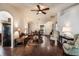 Bright living room with wood floors, vaulted ceilings, and seamless flow to the dining area and kitchen at 284 Lake Suzanne Dr, Lake Wales, FL 33859