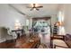 Bright living room with vaulted ceilings, wood floors, and sliding glass doors leading to the outdoor patio at 284 Lake Suzanne Dr, Lake Wales, FL 33859