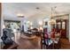Open-concept living room and dining area with hardwood floors, vaulted ceilings, and abundant natural light at 284 Lake Suzanne Dr, Lake Wales, FL 33859