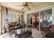 Enclosed sunroom with tiled floor, casual seating, and sliding doors with a view at 284 Lake Suzanne Dr, Lake Wales, FL 33859