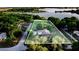 Aerial view of property showing lake access, mature trees, and surrounding neighborhood at 302 W Gates Ave, Lake Hamilton, FL 33851