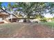 Spacious backyard featuring a mature tree with Spanish moss at 302 W Gates Ave, Lake Hamilton, FL 33851