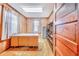 This home office offers a built-in desk, shelving, carpeted floor, and natural light from a window at 302 W Gates Ave, Lake Hamilton, FL 33851