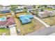 Aerial view showing this home's large yard, metal roof and neighborhood at 317 Oak Trl, Lakeland, FL 33813