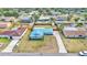 Charming single-story home featuring a long driveway, blue metal roof, and fenced backyard at 317 Oak Trl, Lakeland, FL 33813