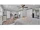 Primary bedroom showcasing barn door closet, recessed lights, wood-look flooring, and neutral color palette at 317 Oak Trl, Lakeland, FL 33813