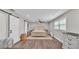 Bedroom features barn doors, recessed lighting, wood-look flooring, and an area rug to soften the room at 317 Oak Trl, Lakeland, FL 33813