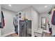 Open walk-in closet with white shelving, a safe, and storage at 317 Oak Trl, Lakeland, FL 33813