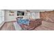 This open concept living room has fireplace, wall decorations, and access to other parts of the home at 317 Oak Trl, Lakeland, FL 33813