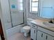 Functional bathroom with a shower over tub, vanity, and toilet at 32 Cedar Dr, Davenport, FL 33837