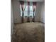 Bedroom featuring carpet and a window that lets in ample natural light at 32 Cedar Dr, Davenport, FL 33837