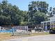 A community pool with Edgehill signage and shaded seating areas at 32 Cedar Dr, Davenport, FL 33837
