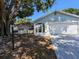 Charming single story home with a front yard, covered front entry, and driveway at 32 Cedar Dr, Davenport, FL 33837