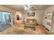 Cozy living room featuring neutral-toned walls, carpet, a ceiling fan, and ample natural light at 32 Cedar Dr, Davenport, FL 33837