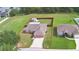 Aerial view of a single-Gathering home with a large, fenced backyard and a storage shed at 3430 Hilson Dr, Lakeland, FL 33812