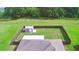 A high-angle aerial view showcases the expansive backyard with a storage shed at 3430 Hilson Dr, Lakeland, FL 33812