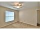 Bright bedroom featuring a large window offering natural light at 3430 Hilson Dr, Lakeland, FL 33812
