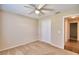 A comfortable bedroom with neutral carpet and a ceiling fan above at 3430 Hilson Dr, Lakeland, FL 33812