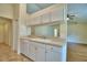 Well-lit kitchen with white cabinets, double sink, and modern appliances, perfect for cooking and entertaining at 3430 Hilson Dr, Lakeland, FL 33812