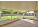 A screened patio overlooking a well-maintained backyard at 3430 Hilson Dr, Lakeland, FL 33812