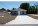 Charming single-story home featuring a freshly painted exterior, a new roof, and a neatly paved driveway at 3434 Avenue E Nw, Winter Haven, FL 33880